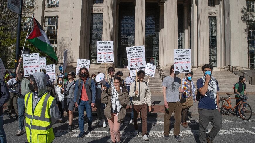Pro-Palestinian protesters march across campus at the Massachusetts Institute of Technology (MIT) after three other protesters were arrested for blocking a parking garage in Cambridge, Massachusetts, on May 9, 2024