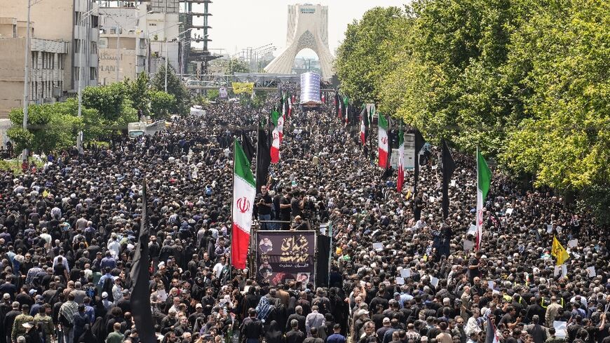 Mourners throng the streets of Tehran for the funeral