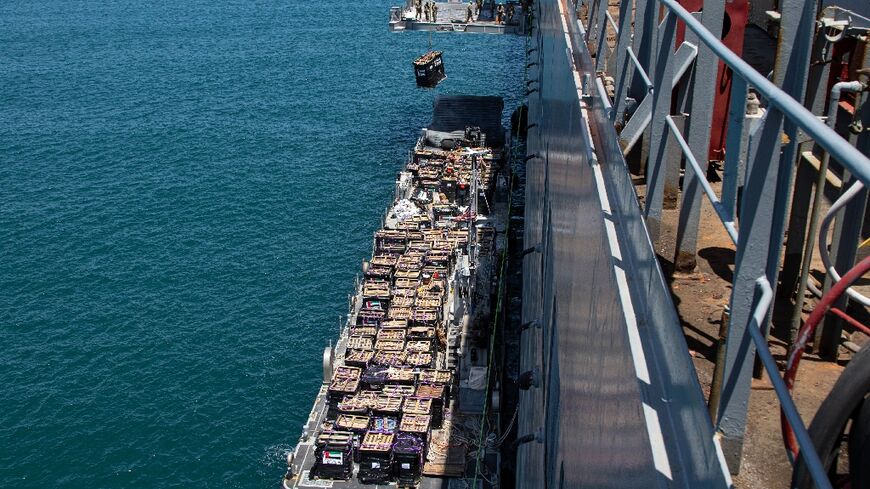 A picture released by CENTCOM shows aid being lifted onto a barge at the Israeli port of Ashdod