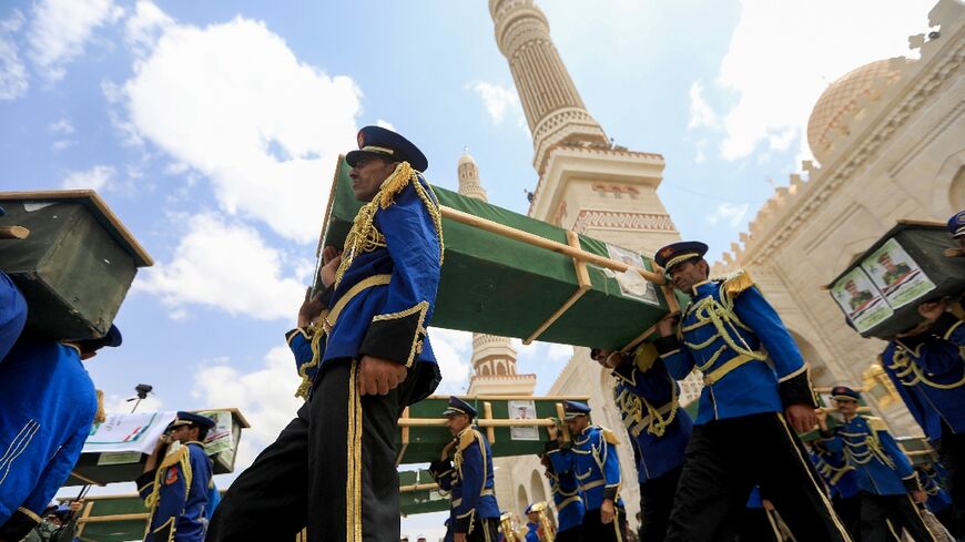 Mourners gathered outside a Sanaa mosque as Huthi fighters staged a parade honouring those killed in US and British strikes