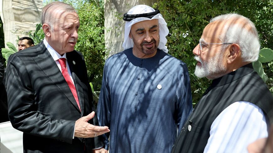 Turkish President Recep Tayyip Erdogan (L) speaks with UAE President Sheikh Mohammed bin Zayed Al Nahyan and Indian President Narendra Modi on the sidelines of the G-7 summit, June 14, 2024, Apulia, Italy.