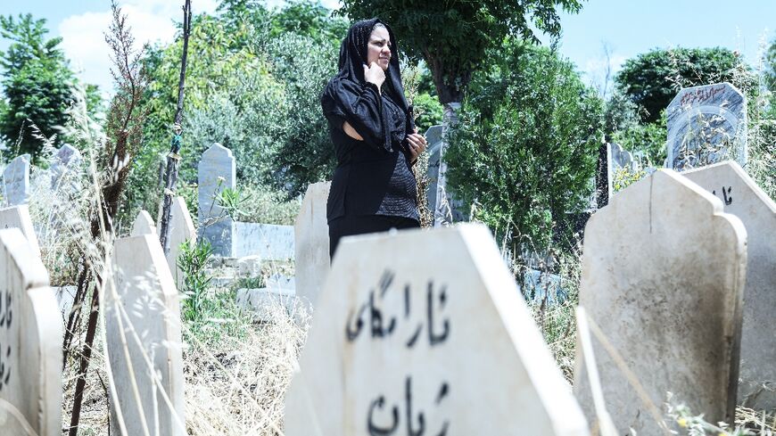 Rozkar Ibrahim, a Kurdish lawyer and women's rights activist, is working to find out the names and causes of death of women buried at the cemetery
