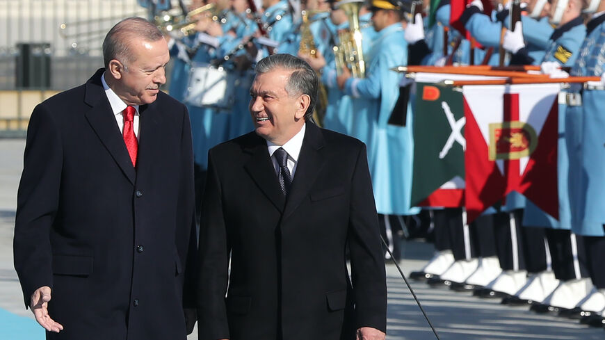 Turkish President Recep Tayyip Erdogan (L) and Uzbekistan President Shavkat Mirziyoyev review the honour guard during a welcoming ceremony at the Presidential Complex in Ankara, Turkey on Feb. 19, 2020. 