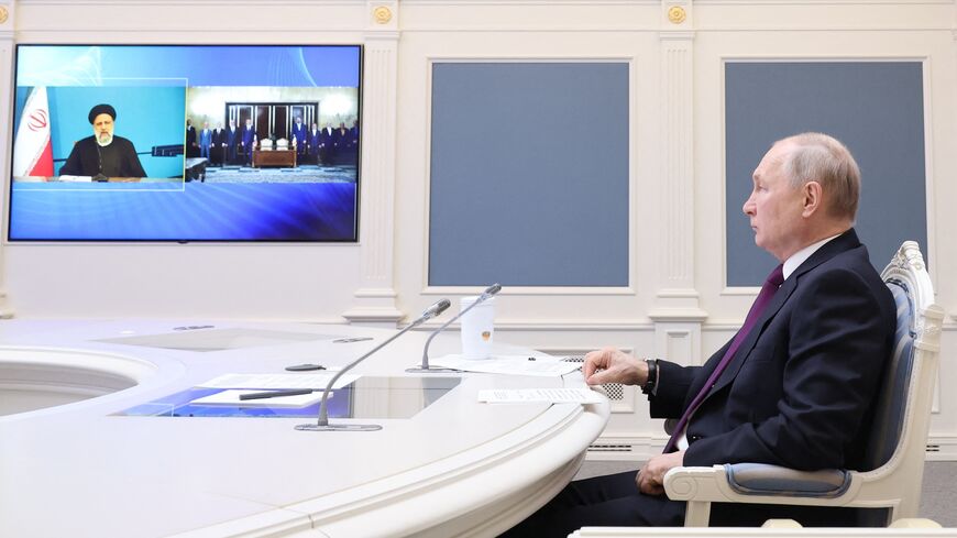 Russian President Vladimir Putin takes part in the ceremony of signing an agreement on the construction of the Rasht-Astara railway.