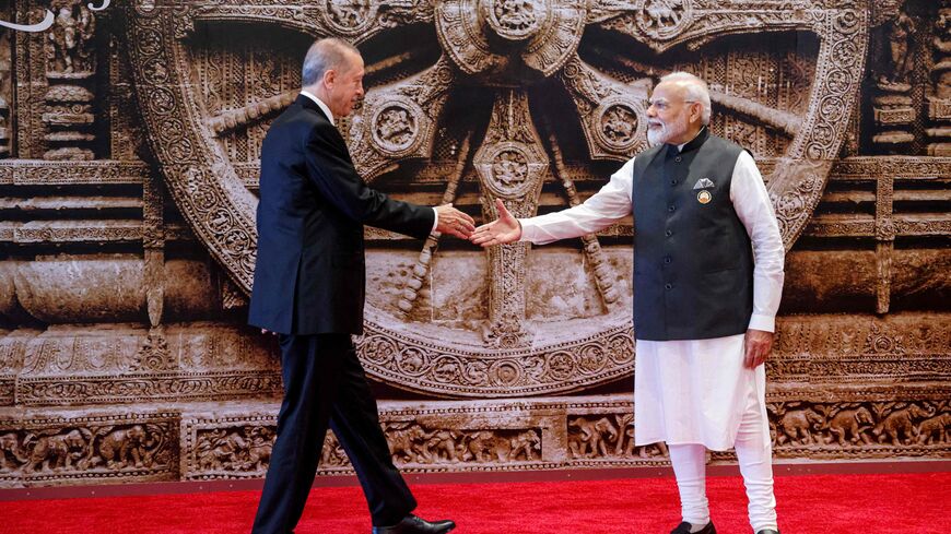 Turkey's President Recep Tayyip Erdogan (L) and India's Prime Minister Narendra Modi shake hands ahead of the G20 Leaders' Summit in New Delhi on September 9, 2023. (Photo by Ludovic MARIN / POOL / AFP) (Photo by LUDOVIC MARIN/POOL/AFP via Getty Images)
