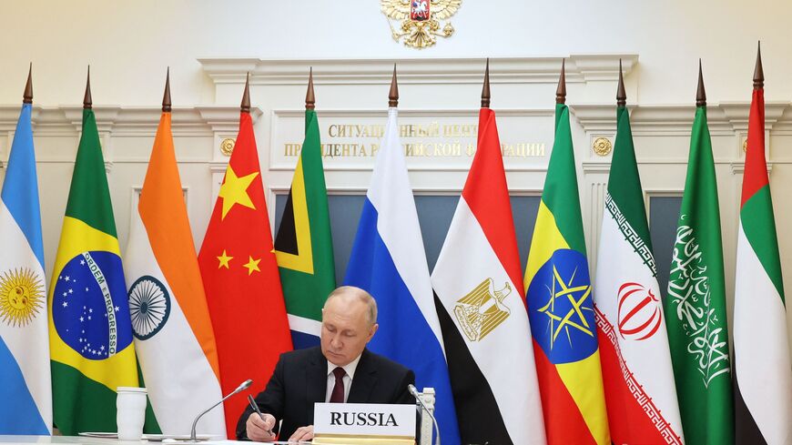 This pool photograph distributed by Russian state agency Sputnik shows Russia's President Vladimir Putin attending a virtual summit of the BRICS group of nations (the bloc that includes Brazil, Russia, India, China and South Africa) to discuss the Israel-Hamas war, in Moscow on November 21, 2023. (Photo by Alexander KAZAKOV / POOL / AFP) (Photo by ALEXANDER KAZAKOV/POOL/AFP via Getty Images)