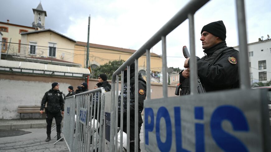 Turkish anti riot police officers block the street of Santa Maria church after an attack in Istanbul, on Jan. 28, 2024. 