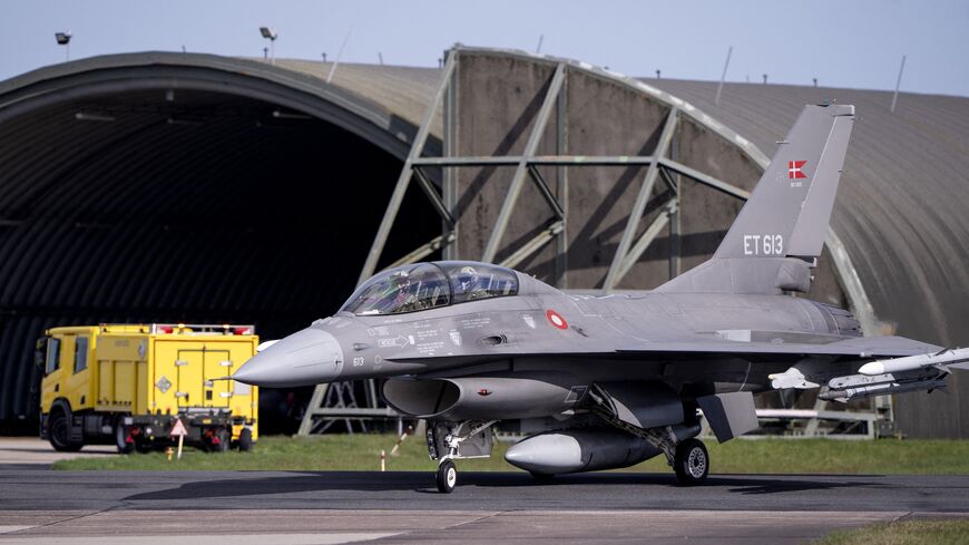 Argentina's Minister of Defence Luis Petri (R) arrives in a Danish F-16 aircraft at Skrydstrup Airport, Denmark, prior his meeting with Denmark's Minister of Defence on April 16, 2024. 