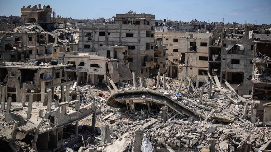 An aerial view of damage to homes following Israeli airstrikes on April 13, 2024, in Khan Yunis, Gaza. 