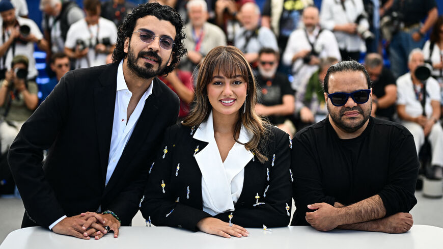 (From L) Saudi actor Yaqoub Alfarhan, Saudi actress Maria Bahrawi and Saudi director and screenwriter Tawfik Alzaidi pose during a photocall for the film "Norah" at the 77th edition of the Cannes Film Festival in Cannes, southern France, on May 24, 2024. 
