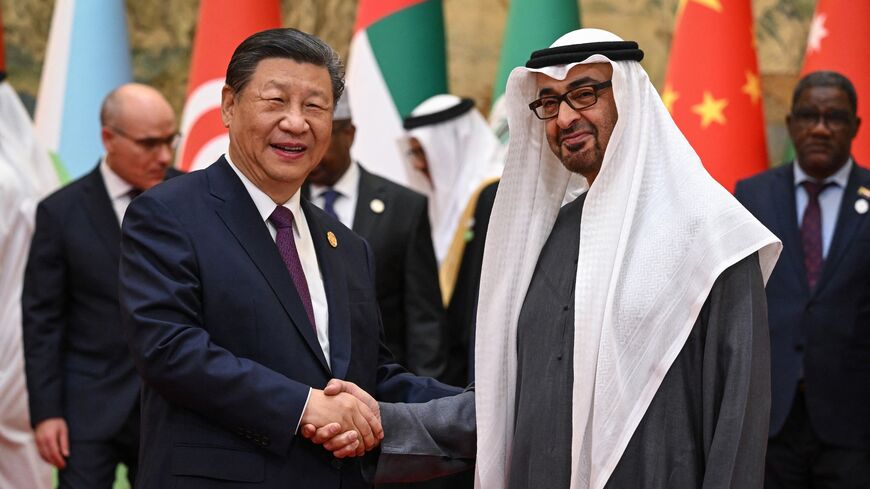 China's President Xi Jinping (L) shakes hands with United Arab Emirates' president, Sheikh Mohamed bin Zayed Al Nahyan, ahead of the opening ceremony of the 10th Ministerial Meeting of China-Arab States Cooperation Forum at the Diaoyutai State Guesthouse in Beijing on May 30, 2024.