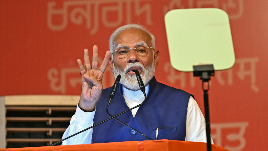 India's Prime Minister Narendra Modi addresses his supporters after Bharatiya Janata Party (BJP) won in country's general election, in New Delhi on June 4, 2024. Modi claimed election victory for his party and its allies on June 4, but the opposition said they had "punished" the ruling party to confound predictions and reduce their parliamentary majority. (Photo by Money SHARMA / AFP) (Photo by MONEY SHARMA/AFP via Getty Images)