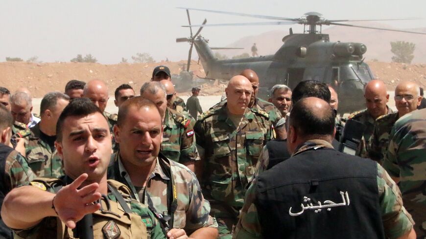 Lebanese army chief General Joseph Aoun (C-back) arrives at an operational command post in the eastern town of Ras Baalbek, on August 23, 2017.