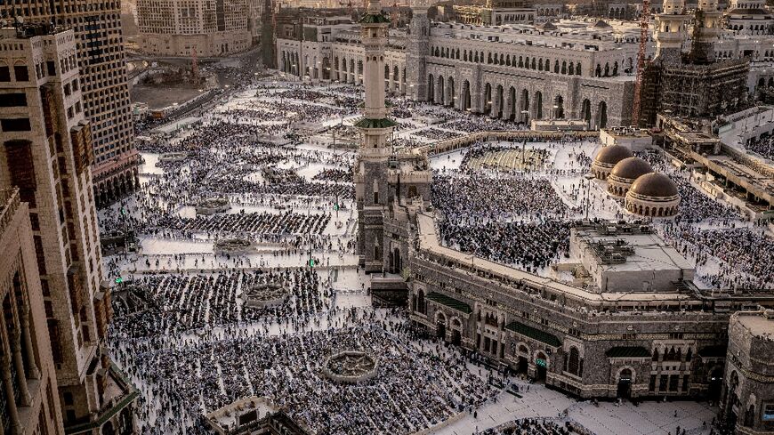 Muslim worshippers walk at the Grand Mosque in Saudi Arabia's holy city of Mecca