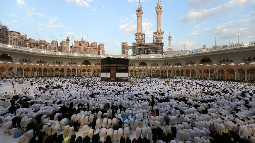 Muslims perform the Eid al-Adha morning prayer around the Kaaba, Islam's holiest shrine, at the Grand Mosque in Saudi Arabia's holy city of Mecca