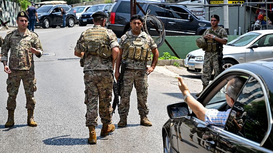 Lebanese troops turn back motorists as they close off access to the area around the US embassy after a shooting