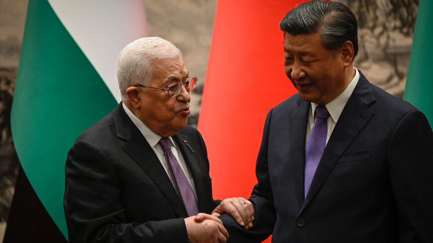 Palestinian President Mahmoud Abbas shakes hands with China’s President Xi Jinping after a signing ceremony at the Great Hall of the People in Beijing on June 14, 2023. 