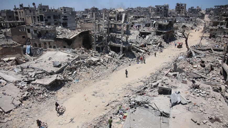 Palestinian residents return to Gaza City's Shujaiya neighbourhood, flattened by a two-week Israeli offensive