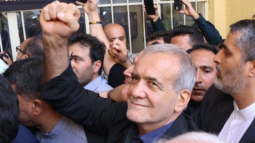 Iranian reformist candidate Masoud Pezeshkian reacts after casting his ballot during the presidential runoff election, in which he was later declared the winner
