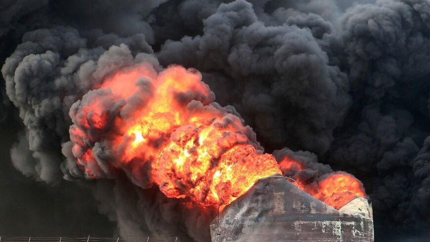 Oil storage tanks burn, a day after Israeli strikes on Yemen's rebel-held Hodeida port