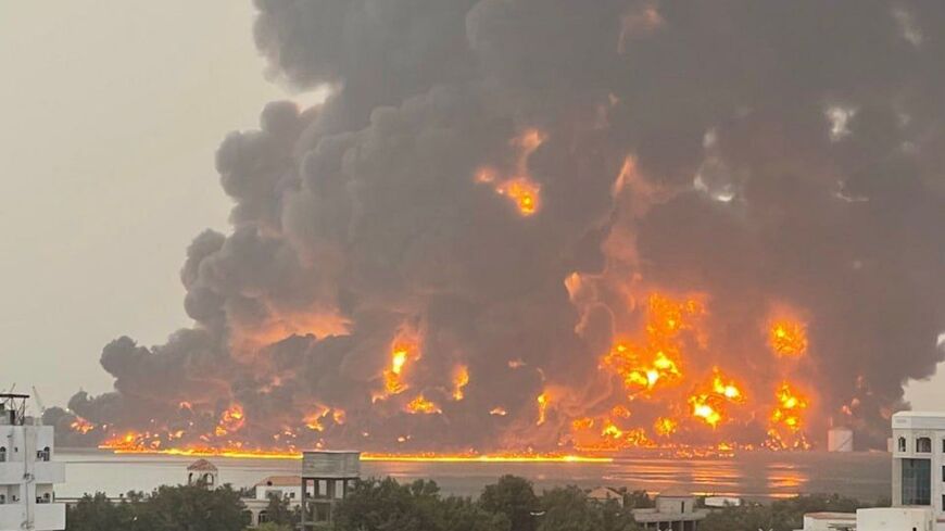 A handout picture obtained from Yemen's Huthi Ansarullah Media Center show a huge column of fire erupting following reported strikes in the Yemeni rebel-held port city of Hodeida opn July 20, 2024. 