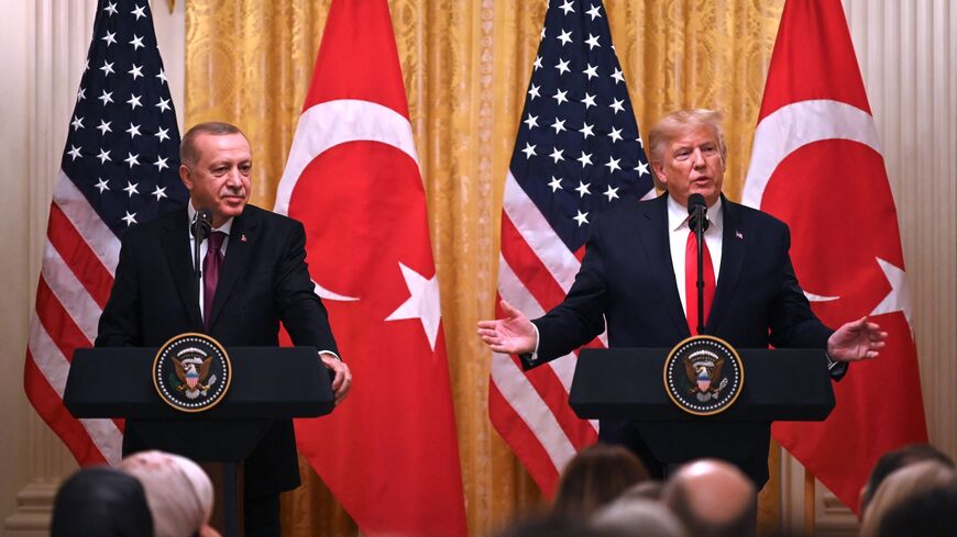 US President Donald Trump and Turkey's President Recep Tayyip Erdogan (L) take part in a joint press conference in the East Room of the White House in Washington, DC on November 13, 2019. 