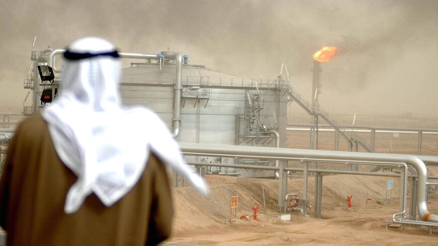 An employee of the Kuwait Oil Company (KOC) looks on Jan. 25, 2005, the Gathering Center No.1 5 of al-Rawdatain field, 100 kilometers north of Kuwait City.
