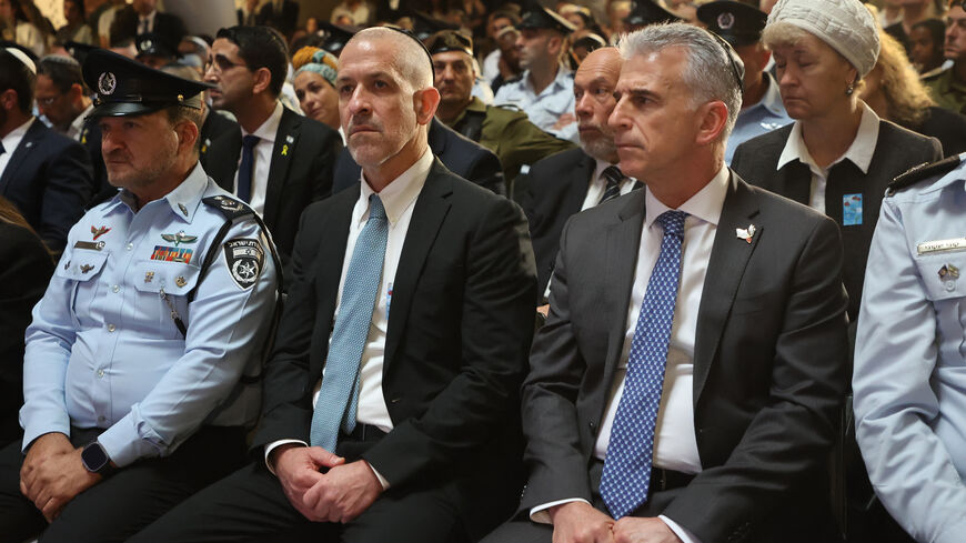 Mossad intelligence agency chief David Barnea (R) and Ronen Bar (2nd L), chief of Israel's domestic Shin Bet security agency, attend a ceremony marking Memorial Day for fallen soldiers of Israel's wars and victims of attacks at Jerusalem's Mount Herzl military cemetery on May 13, 2024. Israel marks Memorial Day to commemorate fallen soldiers and victims of attacks recorded since 1860 by the defence ministry, just before the celebrations of the 75th anniversary of its creation according to the Jewish calenda