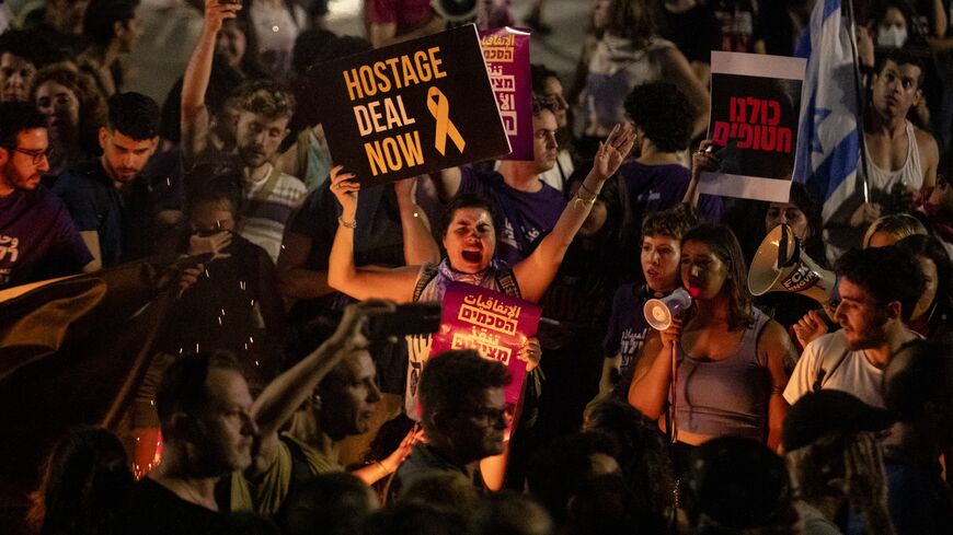 Protesters hold signs during a demonstration calling for a hostage deal with Hamas.