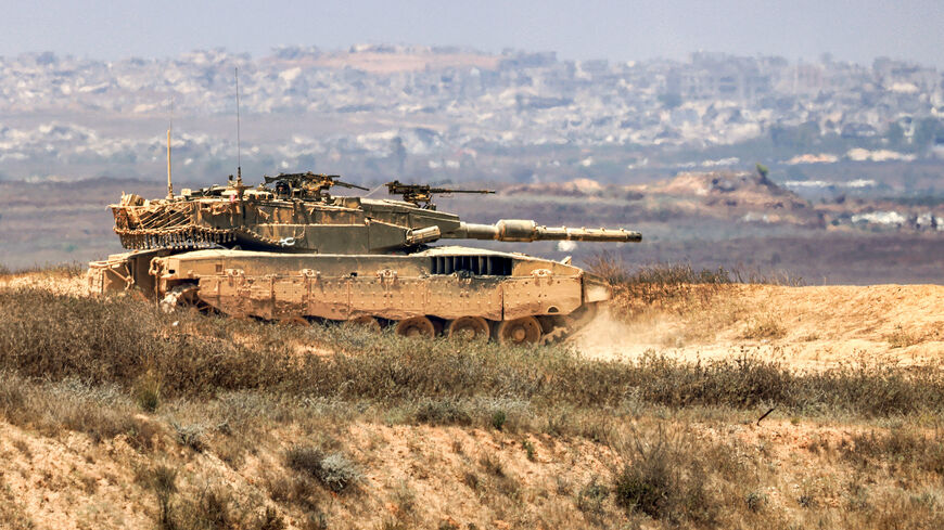 An Israeli army main battle tank moves along an area near the border with the Gaza Strip and southern Israel, July 2, 2024.