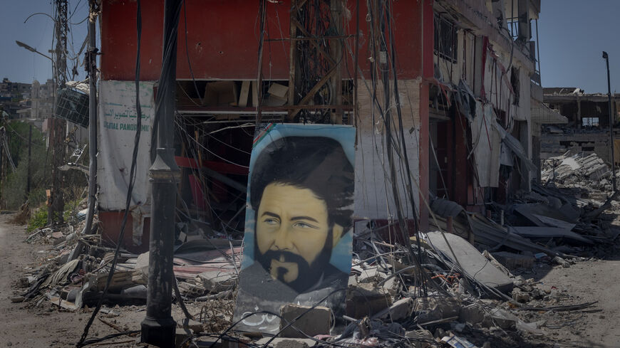 A portrait of Musa al-Sadr sits amid the rubble of a destroyed building in the heavily damaged, Hezbollah stronghold town of Aita al Chaab on June 29, 2024 in Aita al Chaab, Lebanon. Hezbollah and the Israeli Defense Forces (IDF) have been trading cross-border fire since the October 7 attacks, with the conflict escalating in May when the group launched a missile-carrying drone against Israel for the first time. The conflict intensified in June when Hezbollah fired hundreds of rockets and drones at Israeli m