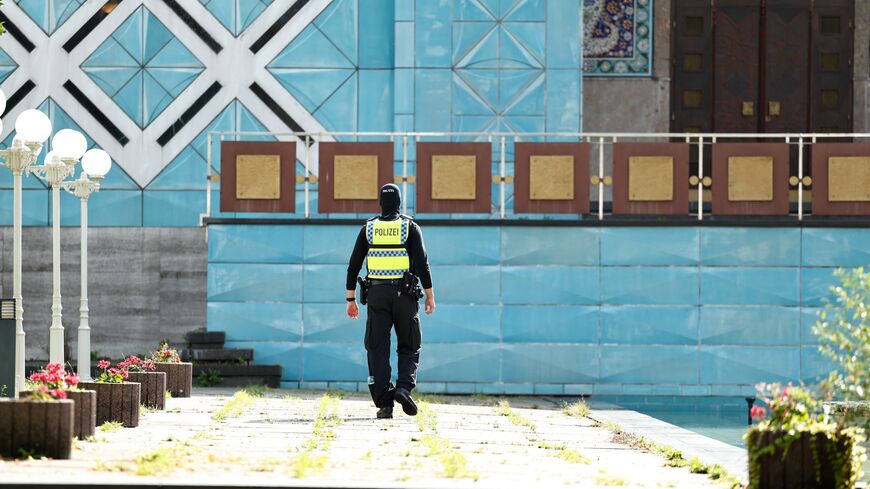 A police officer is seen in front of the Blue Mosque, housing the Islamic Centre of Hamburg, northern Germany, on July 24, 2024.