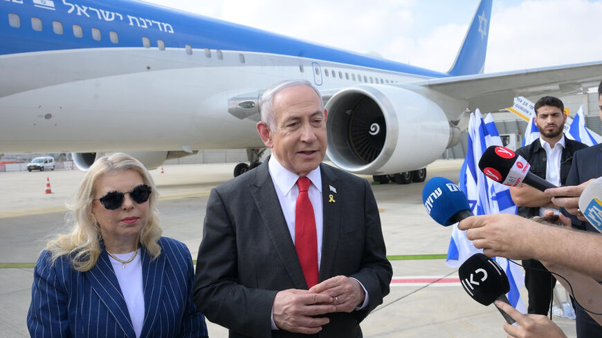 Israel's Prime Minister Benjamin Netanyahu, accompanied by his wife, are interviewed before the departure for Washington, Ben-Gurion Airport, Israel, July 22, 2024. 