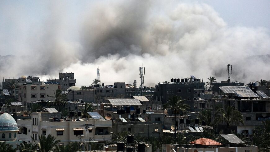 Smoke rises during an Israeli strike in Deir el-Balah, central Gaza