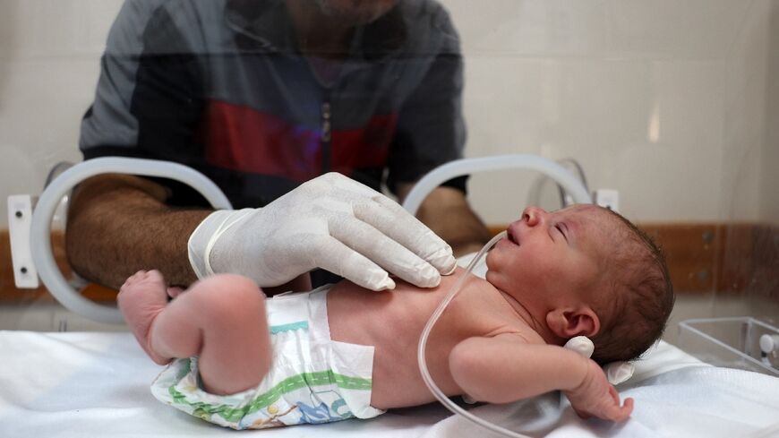 Baby Malek Yassin was delivered by emergency Cesarean section after his mother died of wounds sustained in an Israeli strike, doctors at Gaza's Al-Awda Hospital say