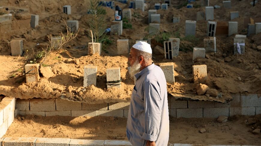 Palestinian gravedigger Saadi Hassan Barakeh say he has been burying the dead for 28 years, but has never been so busy amid the Gaza war