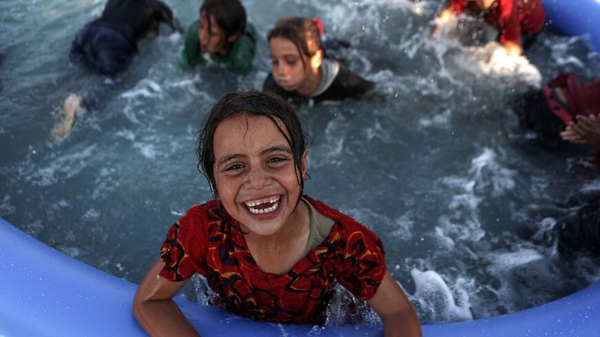 The mobile swimming pools were brought to the camp for displaced people in northern Syria by the Smile Younited charity