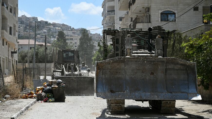 Israeli bulldozers rumble along a street in Jenin on August 31, 2024