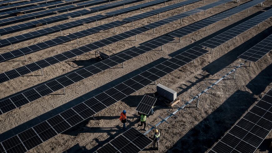 Employees install new solar panels at the Kalyon Energy's Karapinar Solar Power Plant, Karapinar, Turkey, December 2, 2021.