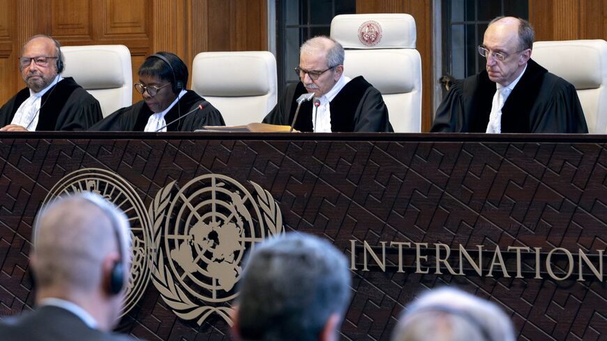 Judge and president of the International Court of Justice (ICJ), Nawaf Salam (2nd R) delivers a nonbinding ruling on the legal consequences of the Israeli occupation of the West Bank and East Jerusalem at the International Court of Justice (ICJ) in The Hague on July 19, 2024. 