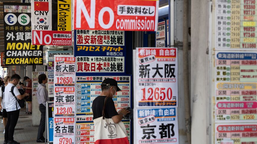 Customers wait outside currency exchange stores on Aug. 5, 2024, in Tokyo, Japan.