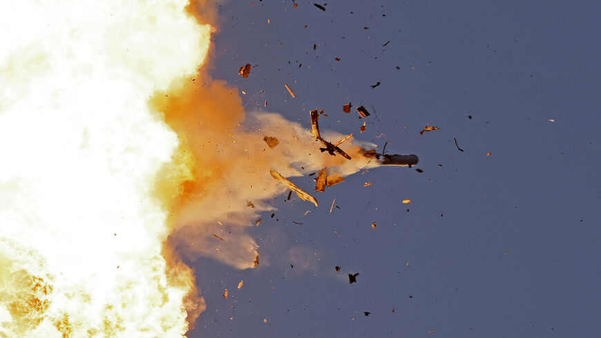 TOPSHOT - This photo taken from a position in northern Israel shows a Hezbollah UAV intercepted by Israeli air forces over north Israel on August 25, 2024. The Israeli military announced early August 25, 2024 that it was conducting pre-emptive strikes in Lebanon after detecting preparations for "large-scale" attacks by the Iran-backed militant group Hezbollah. Hezbollah said it had launched more than 320 rockets at Israel overnight, targeting a string of military positions, even as Israel's military said it