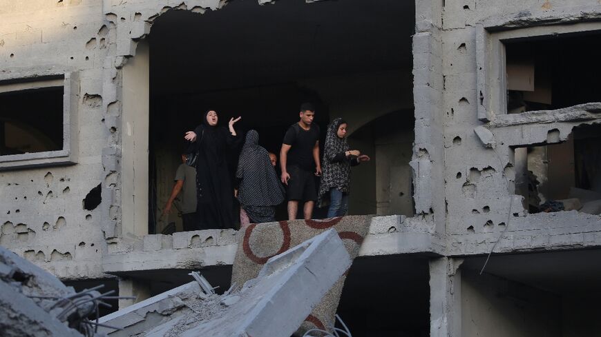 Palestinians in damaged building following nearby Israeli bombing in the Nuseirat refugee camp in the central Gaza Strip