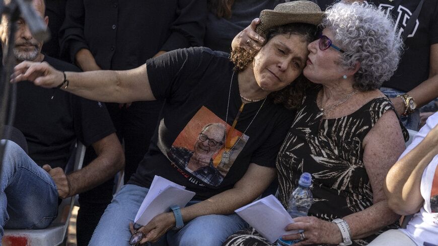 Ruti and Keren Munder mourn husband and father Avraham Munder who was taken hostage by Palestinian militants during their October 7 attack on Israel