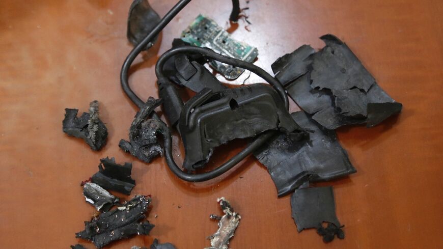 The remains of exploded Hezbollah pagers are put on display at an undisclosed location in Beirut's southern suburbs, a stronghold of the militant group