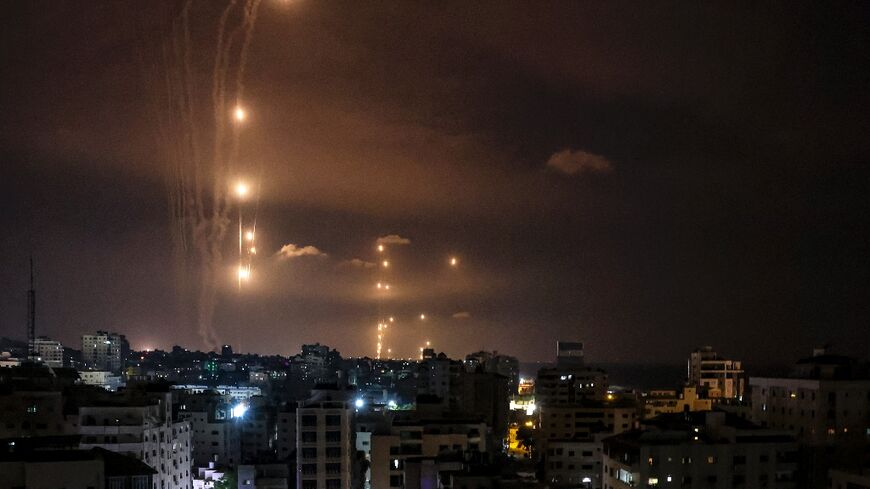 Rockets fired by Palestinian militants from Gaza are intercepted by Israel's Iron Dome defence system on October 7, 2023