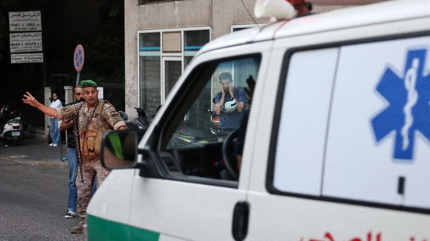 An ambulance rushes people to hospital in Beirut, after paging device explosions