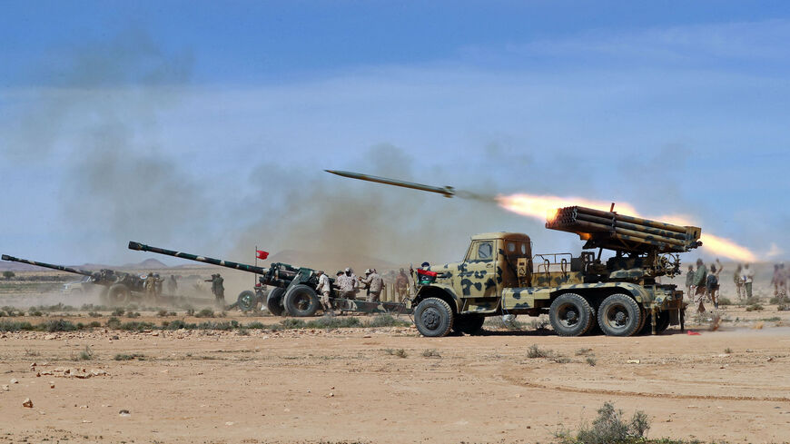 Members of the Libyan Army, under the command of the internationally recognized Government of National Unity, fire live ammunition during a drill in the western town of Tarhuna , on March 6, 2023. 