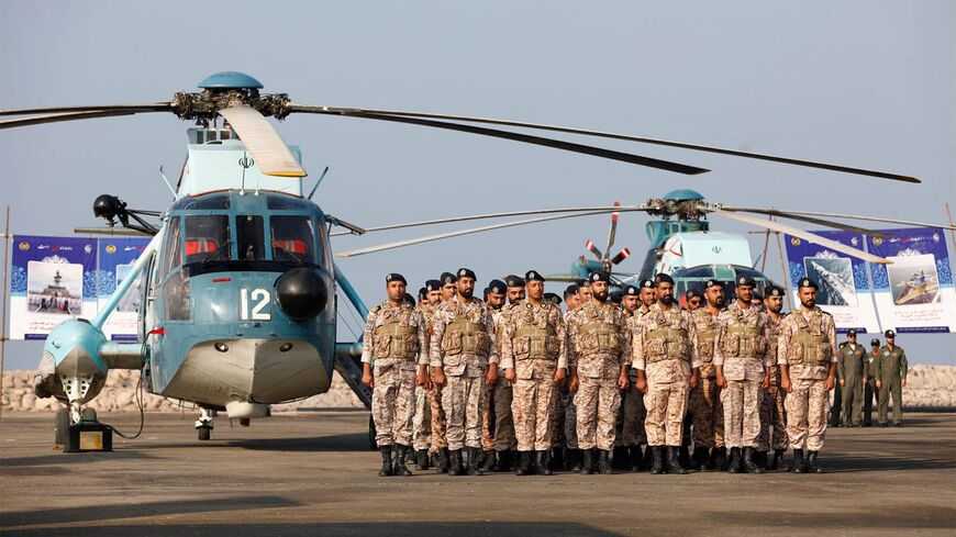 This handout picture provided by the Iranian Army office on Dec. 24, 2023, shows soldiers attending the unveiling ceremony of a new missile system.