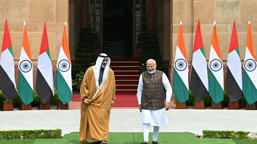 Abu Dhabi's Crown Prince Sheikh Khaled bin Mohamed bin Zayed Al Nahyan (L) listens to India's Prime Minister Narendra Modi before their meeting at the Hyderabad House in New Delhi on September 9, 2024.